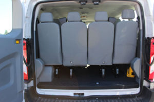 Ford Transit Van View of Rear with Door open. 15 Seats total.